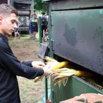 A worker at Kornman pulls corn from an oven at the Washington Brewers Festival on Sunday. Aaron Kunkler/Redmond Reporter