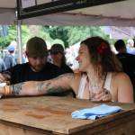 Karen Troy, taproom manager for Black Raven Brewing in Redmond, staffs the kiosk during last weekend&rsquo;s Washington Brewers Festival at Marymoor Park. Aaron Kunkler/Redmond Reporter
