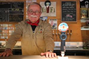 John Carothers, owner of Hi-Fi Brewing in Redmond, is seen here at his brewery and tap room. Their Headphone summer seasonal uses a blend of Columbus, Amarillo, Mandarina Bavaria and El Dorado hops as well as citrus flavors. Aaron Kunkler, Redmond Reporter                                John Carothers, owner of Hi-Fi Brewing in Redmond, is seen here at his brewery and tap room on Monday. Aaron Kunkler/Redmond Reporter