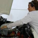Sharon Crosetto cleans the V-8 engine she installed in the AM General 1982 jeep she and her daughter use at Moonie Icy Tunes. Moonie was started around nine years ago and moved to Redmond last winter. Aaron Kunkler/Redmond Reporter