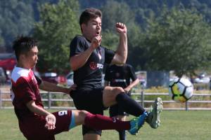 Going strong for the ball at Crossfire Challenge College Showcase