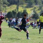 Going strong for the ball at Crossfire Challenge College Showcase