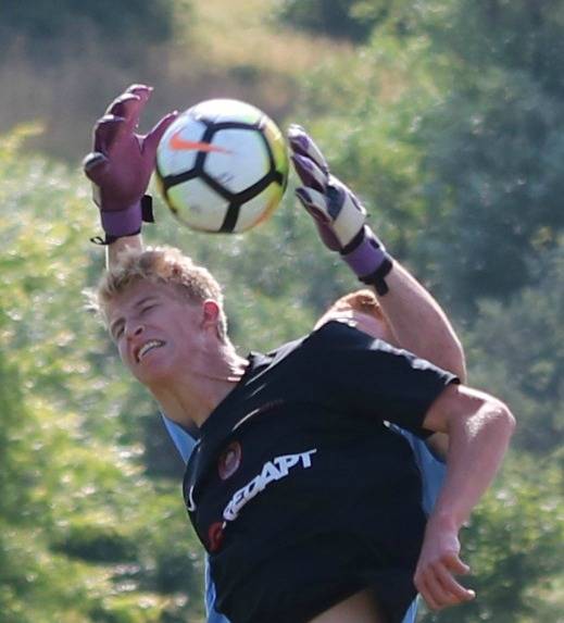 Going strong for the ball at Crossfire Challenge College Showcase