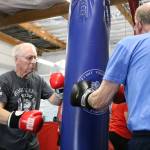 Brian Shook, left, boxes at the Rock Steady Boxing program for people with Parkinson&rsquo;s. Aaron Kunkler/Redmond Reporter