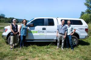 From left to right: Lindsey Robinson, Hopelink Harvest program coordinator; Lauren Thomas, Hopelink CEO; Anthony DiBlasi, Washington state president of Bank of America; Adam McCurdy, Oxbow Farm & Conservation Center. Courtesy photo