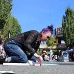 Maggie Johnson showcases her work during last weekend&rsquo;s Pacific NW Chalk Fest. Aaron Kunkler/Redmond Reporter