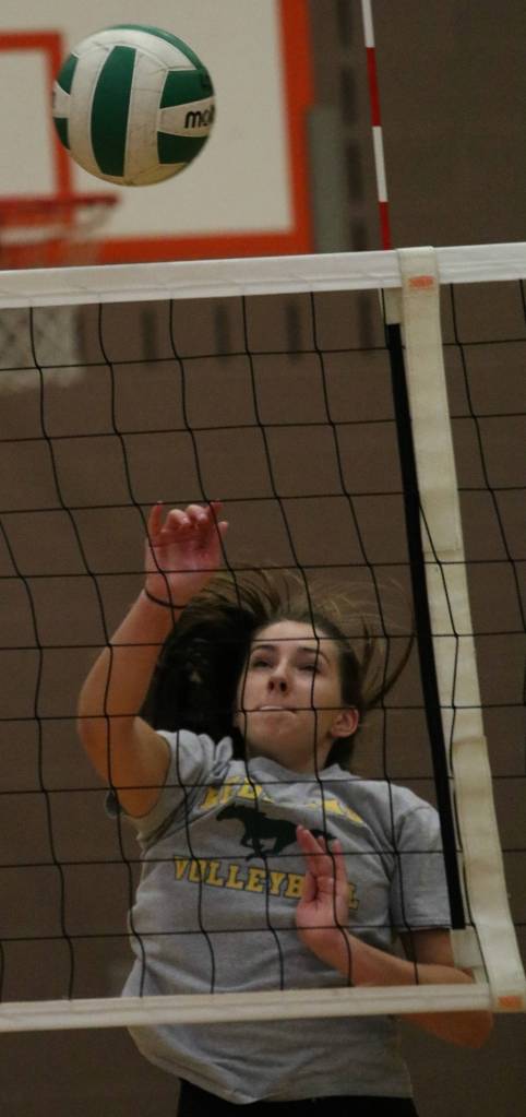 Emma Thomas hammers a kill during practice.