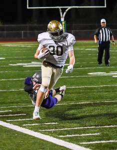 Redmond High&rsquo;s Carson Bruener tears up field during last Friday night&rsquo;s game. Courtesy of Matt Campbell Photography, www.sportspixs.com