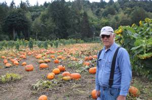 Bill Serres stands in front of one of his pumpkin patches on Monday morning. Aaron Kunkler/Redmond Reporter