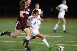 Redmond&rsquo;s Andrea Dang, right, battles for the ball with Mercer Island&rsquo;s Kendall Riley. Courtesy of Dale Garvey
