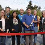 From left to right at the Redmond Central Connector Phase II opening: Redmond City Council members Angela Birney, Hank Margeson, Tanika Padhye, John Stilin, Mayor John Marchione, and city council members Byron Shutz and Hank Myers. Not pictured: City council member David Carson. At right, an artist’s rendering of a portion of the connector. Courtesy photo and graphic
