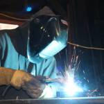 Morgan Scarboro welds at Ace Iron Works in Redmond. Aaron Kunkler/ Redmond Reporter