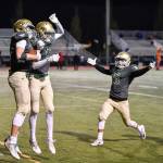 Redmond&rsquo;s Carson Bruener (left) celebrates his game-winning touchdown with teammates Keith Jenks, Nikhil Jatekar and Bradley Cagle. Courtesy of Marc La Pierre Photography http://marclapierre.photodeck.com/