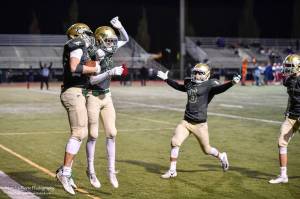 Redmond&rsquo;s Carson Bruener (left) celebrates his game-winning touchdown with teammates Keith Jenks, Nikhil Jatekar and Bradley Cagle. Courtesy of Marc La Pierre Photography http://marclapierre.photodeck.com/