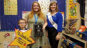 Alcott Elementary teacher Jennifer Kuehnle (center) receives her STAR 101.5 Elementary Teacher of the Week award. Also pictured are student Emerson Cousens and Anna Teachman, the Washington State Dairy Ambassador. Courtesy photo