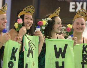From left, Redmond High&rsquo;s swim and dive team members Katelyn Harper, Allison Chen, Emily Whelan and Kristen Harper enjoy their time in the senior-honors spotlight on Oct. 19 at Redmond Pool. Redmond beat Eastlake during the Pink Out meet for breast-cancer awareness. Other Mustang seniors are Olivia Martin, Emily Martin, Anna Hammond, Katie Chalmers, Katherine Getchell, Allie Hanson, Karina Lara-Perez, Chloe Moore, Virginia Qian and Reika Sasano. Andy Nystrom/Redmond Reporter