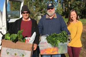 Taylor Moore, Farms for Life operations chair (right), with Michael Given and Scott Wootan from HERO House. Courtesy photo