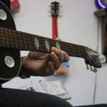 Dave Head, a music instructor at The Music Haven, plays one of his many guitars last Friday. Aaron Kunkler/Redmond Reporter