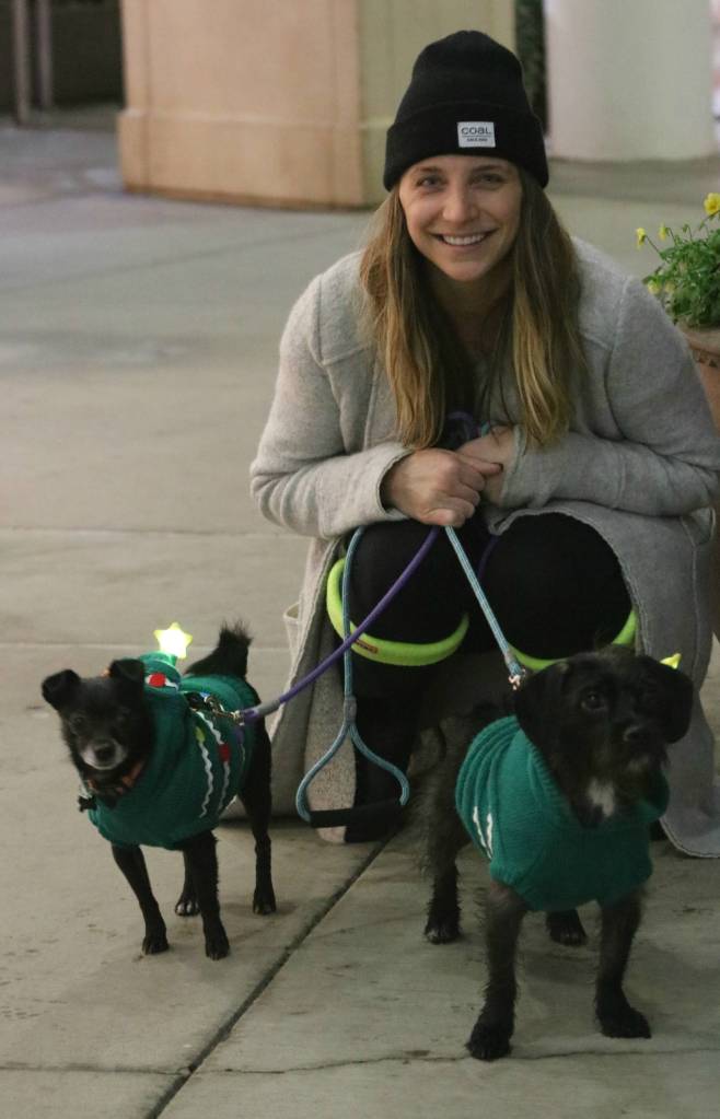 Samantha Blevins poses with her dogs, Noelle and Molly, tonight at Redmond Town Center.