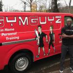 Stacy Edwards, owner of the Eastside GYMGUYZ franchise, opens his van to show the various equipment his trainers use with their clients. Kailan Manandic, Kirkland Reporter