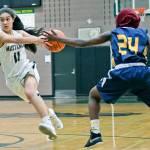 Redmonds Sami Castanos drives past Everetts Amina Hussein. Courtesy of Dale Garvey