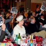 Bidding at the live auction (Debra Pelletier in white). Courtesy of Patsy Rosenbach