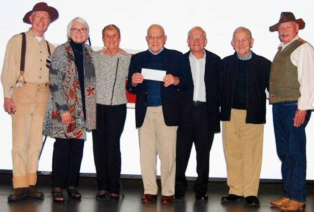 Emcee John Oftebro, Sherry Stilin, Diana Morelli, Panfilo Morelli, Robert Morelli, Dante Morelli and Society President Joe Townsend. The Morelli brothers presented a check for a $5,000 donation, part of a five-year pledge of $25,000. Courtesy of Patsy Rosenbach