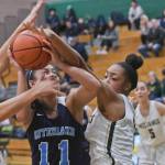 Redmonds Katie Hartman (left) and Kiki Milloy (center right) battle for the ball with Interlakes Angel Le during Tuesdays game. Redmonds Meghan Egberg is in the background. Courtesy of Dale Garvey