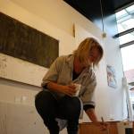 Jacqueline Calladine is an artist at VALA Eastside who uses natural ingredients to make art centered around the environment. She is seen here working on a painting. Aaron Kunkler/Redmond Reporter