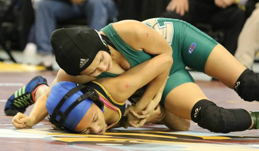 Redmonds Leah Hiatt, top, wrestles at state. Andy Nystrom, Reporter