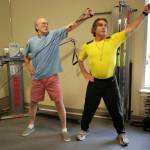 Ron Cole, right, provides instruction on proper form to an Emerald Heights resident. Courtesy of Frare Davis Photography