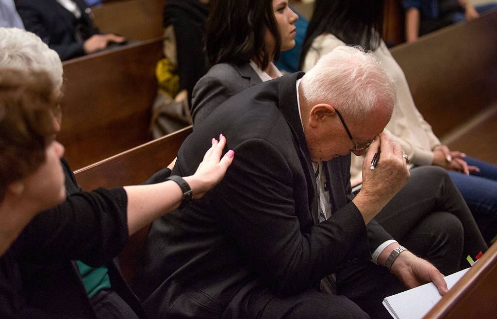 Mike Shunn reacts as Snohomish County chief criminal deputy prosecutor Craig Matheson makes opening statements in the trial of John Blaine Reed, accused of murdering Monique Patenaude and Patrick Shunn, at the Snohomish County Courthouse on Thursday in Everett. (Andy Bronson / The Herald)