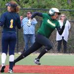 Kiki Milloy on her way to a triple. Andy Nystrom / staff photo
