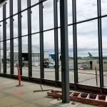 The passenger terminal at Paine Field in Everett features large windows. (Janice Podsada / The Herald)