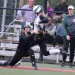 Close game, close play: Camille Eaton is just inched out at first. Andy Nystrom / staff photo