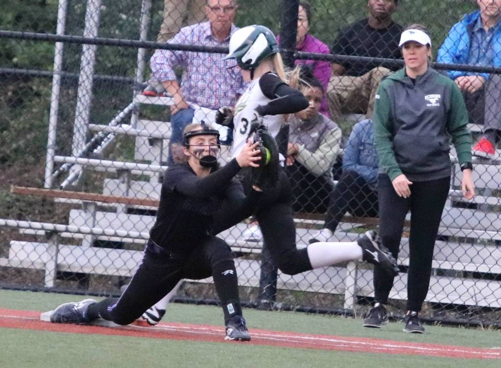 Close game, close play: Camille Eaton is just inched out at first. Andy Nystrom / staff photo