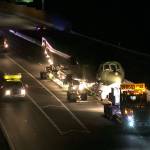 The B-52 Midnight Express is towed along Highway 525 from Paine Field en route to Boeing Field in Seattle early Sunday morning. (Kevin Clark / The Herald)