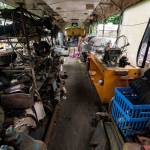 The interior of one of the several buses found on Pillons property. The buses in the illegal junkyard are often used as storage for other artifacts found in the rubble. Photo by Caean Couto