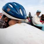 Micah Knowles, 10, gets ready for his first test ride in a practice soap box derby car on the track. (Andy Bronson / The Herald)