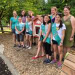 Members of Girl Scout Troop 44133 help install a Little Free Library at Grass Lawn Park. Contributed photo