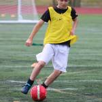Liam Cain dribbles up field during the camp. Andy Nystrom / staff photo