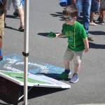 A young resident plays a cornhole game at Derby Days in Redmond. Katie Metzger/staff photo