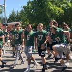 Redmond High School football players march in the Derby Days parade. Photo courtesy of Peg Jatekar