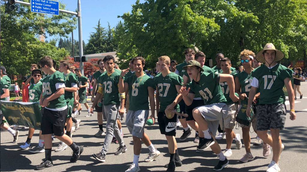 Redmond High School football players march in the Derby Days parade. Photo courtesy of Peg Jatekar