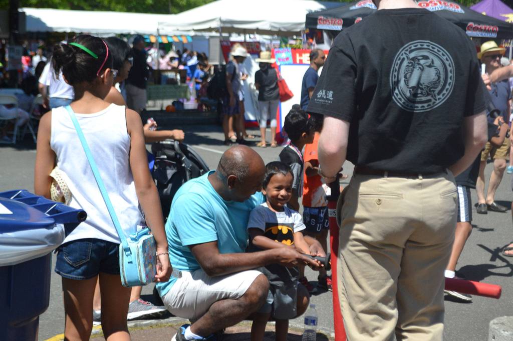 A family enjoys the activities at Derby Days in Redmond. Katie Metzger/staff photo