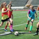 Jr. Stangs Soccer Camp participants engage in a mini-game at Redmond High on July 17. Andy Nystrom / staff photo