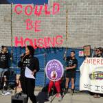 Nikkita Oliver speaks at a July 17 No New Youth Jail press conference in front of the construction site of the King County Youth Detention Center. Photo by Josh Kelety