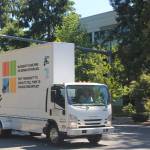A van drove around the Microsoft campus during a rally in which activists turned in 300,000 signatures asking the company to cancel a contract with Immigration and Customs Enforcement. Aaron Kunkler/Staff photo