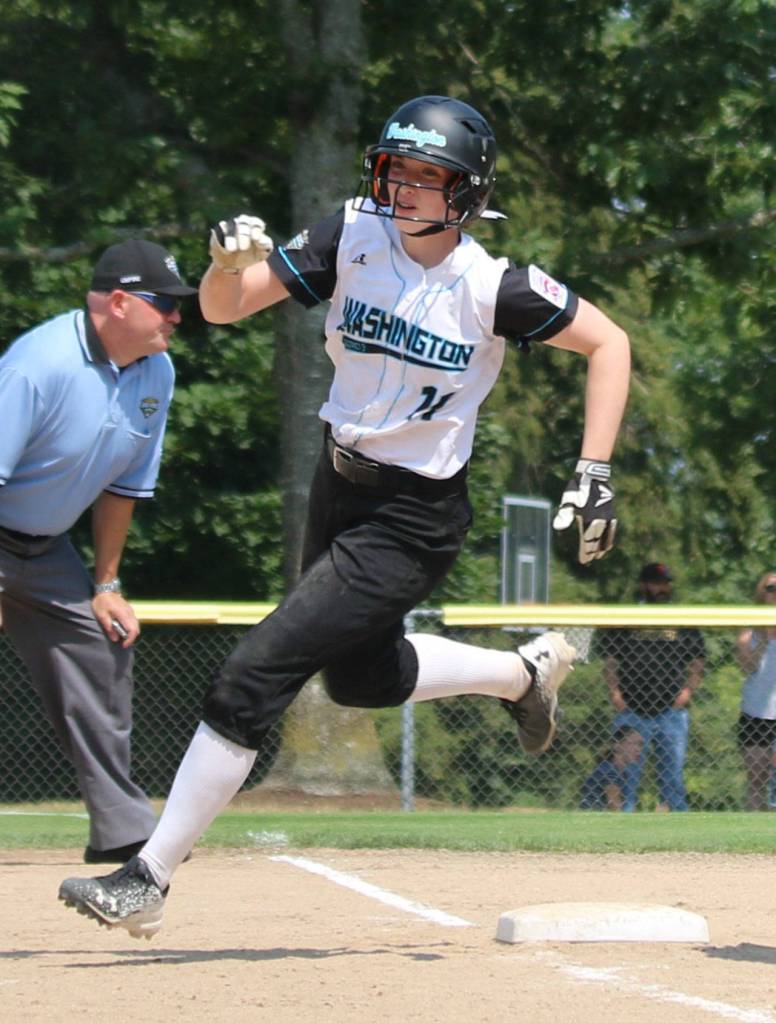 Hannah Price rounds third base on her way to scoring a run.