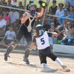 Kimora Johnson slides safely into home.